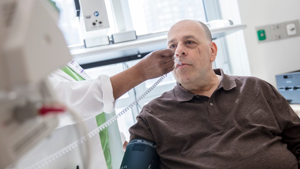 Clinician Checks Patient’s Temperature