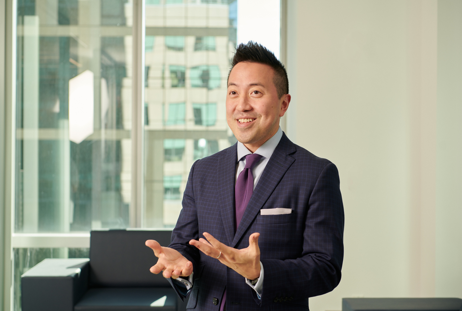 Dr. Kwak smiling and gesturing with his hands