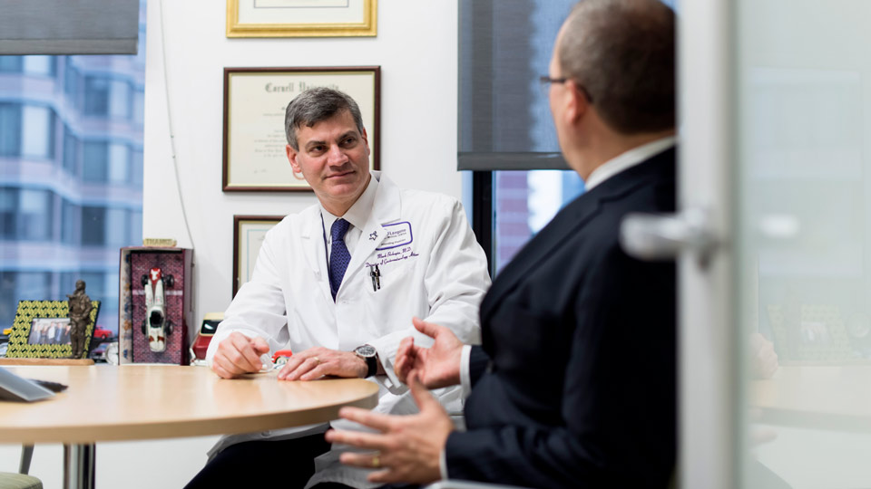 Dr. Mark Pochapin Talks to a Patient