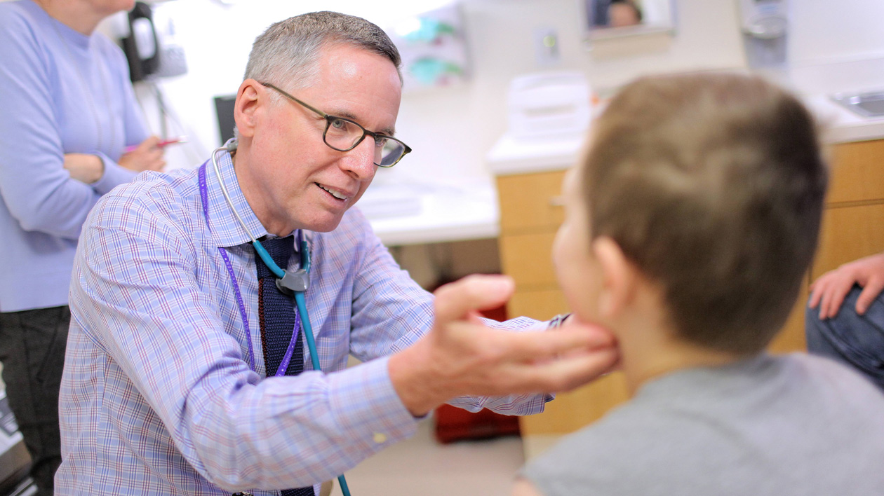 Doctor Examines Pediatric Patient