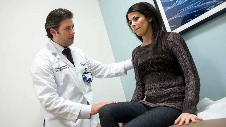 Doctor Checks Patient’s Knee