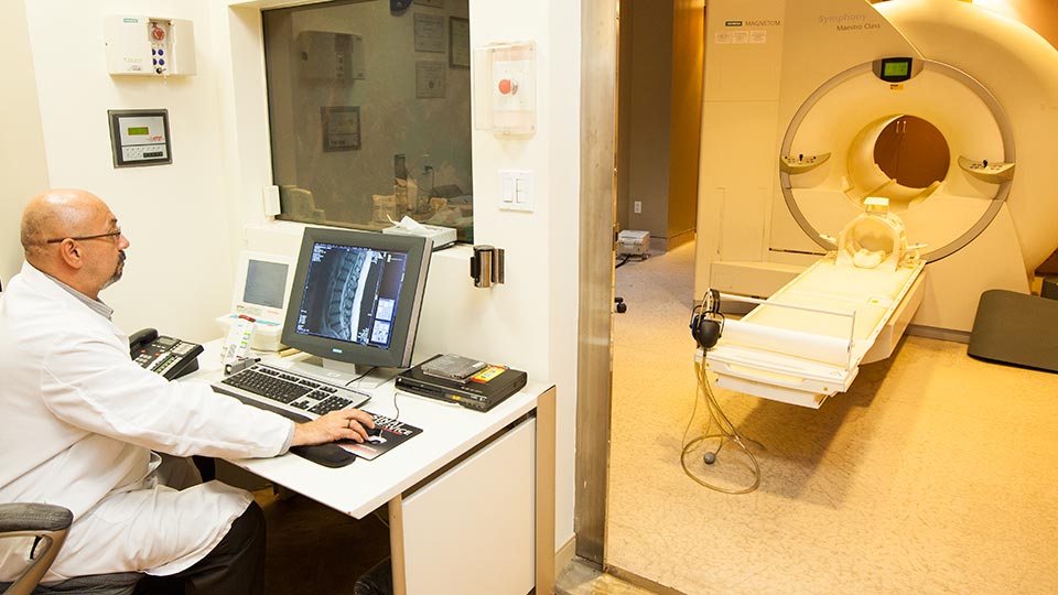Radiologist Reviews MRI Scans
