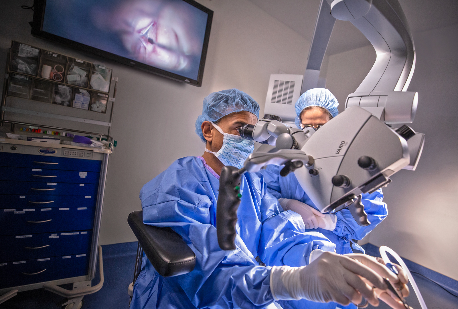 Dr. Amin and colleague performing procedure in operating room